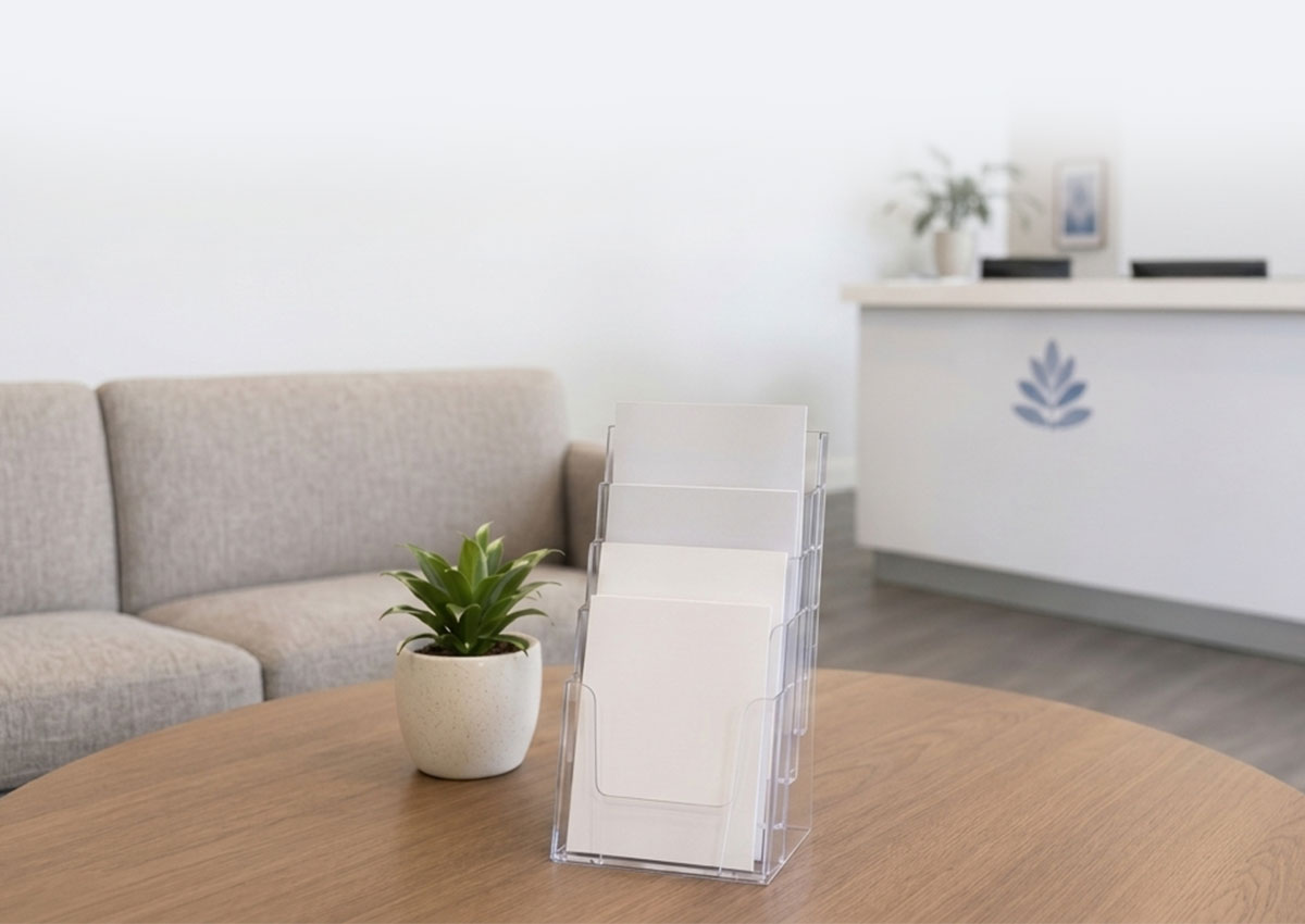 Clear A4 brochure holder organising healthcare brochures on a medical waiting room table